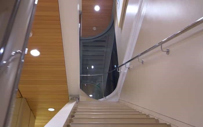  The curves of the house extend to this super-cool stairwell. Image via Vimeo. Listing agent: Eric Latta