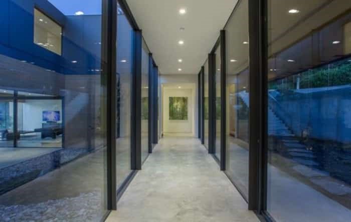  This architecturally stunning home has an unusual U-shape with a glass corridor. Listing agent: Geoff Taylor