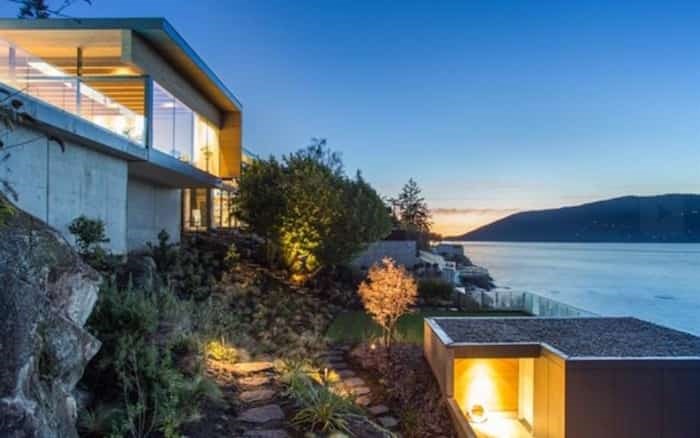  This shot shows how the home is built into a bluff, and has terraced gardens. On the lower right is a separate guest house. Listing agent: Geoff Taylor