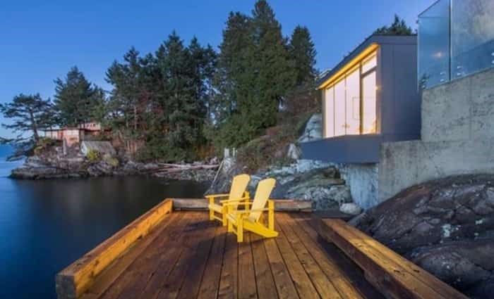  Below the separate guest house and lawn level, right down by the water, is this perfect-for-summer deck. Listing agent: Geoff Taylor
