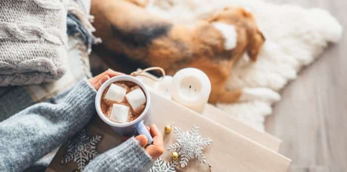  Woman hands with cup of hot chocolate close up image / Shutterstock