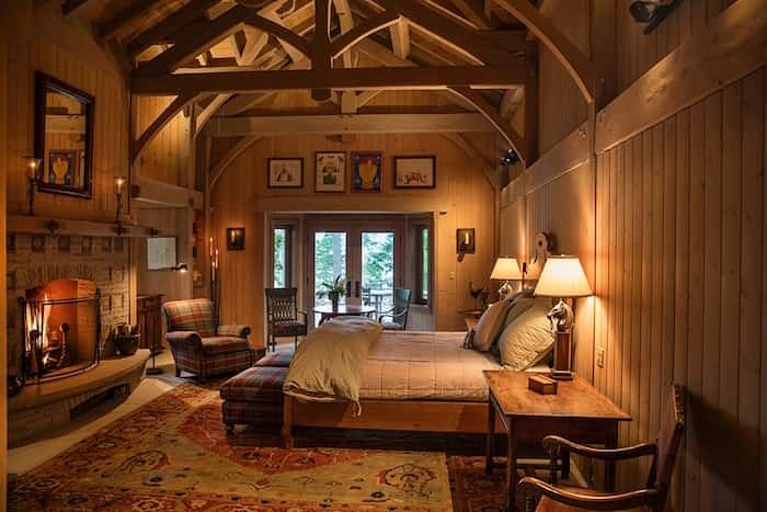  One of two master bedroom suites, this master has vast vaulted ceilings and a stone fireplace, echoing the great room. Image supplied by Engel & Völkers