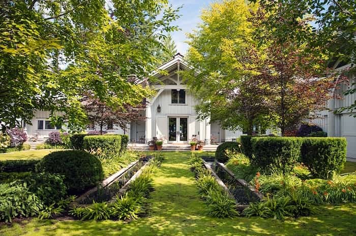  Considering the rustic interior of the house and its remote location, these courtyard gardens are surprisingly formal. Image supplied by Engel & Völkers