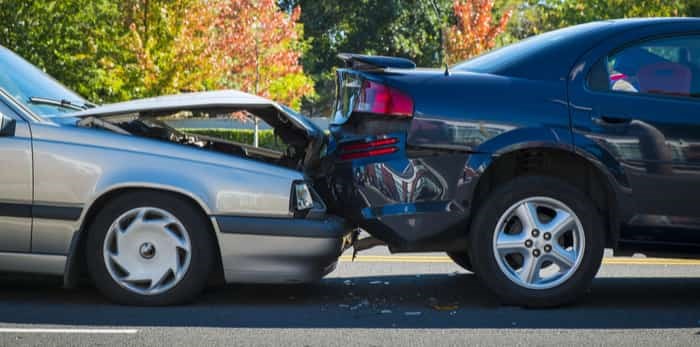  Auto accident involving two cars on a city street / Shutterstock