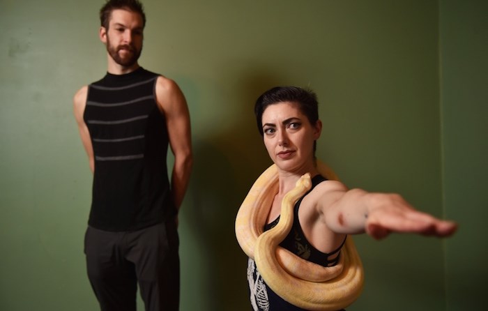  Lukas Knab and Tristan Risk alongside Eros, a nearly six foot long albino boa constrictor. The pair are bringing snake yoga to Vancouver for the first time in January. (Vancouver Courier)