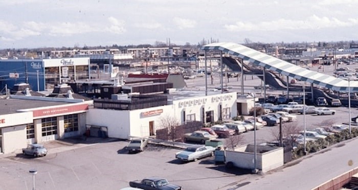  This image, looking southeast toward No.3 Road in 1973, shows the Skookum Slide on the right, the back of the Richmond Savings Credit Union in the centre and Wosk’s Furniture on the left.