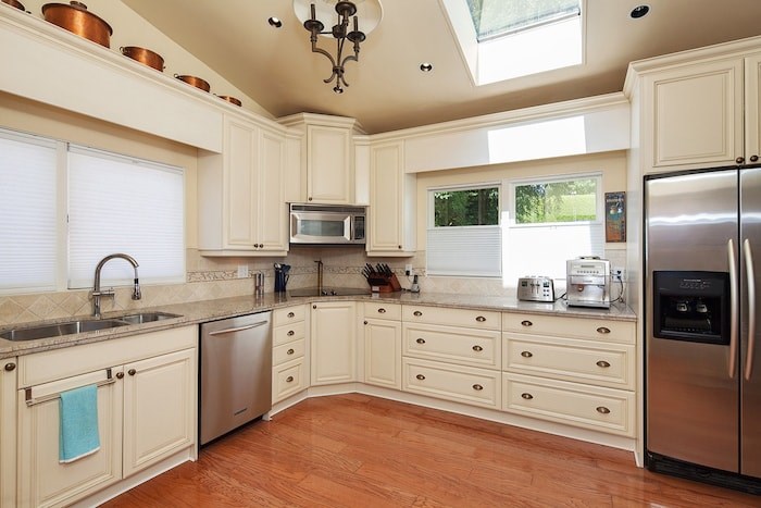  Designed in the 1950s, the kitchen is medium sized and functional, with a casual eating area at the other end. Image supplied