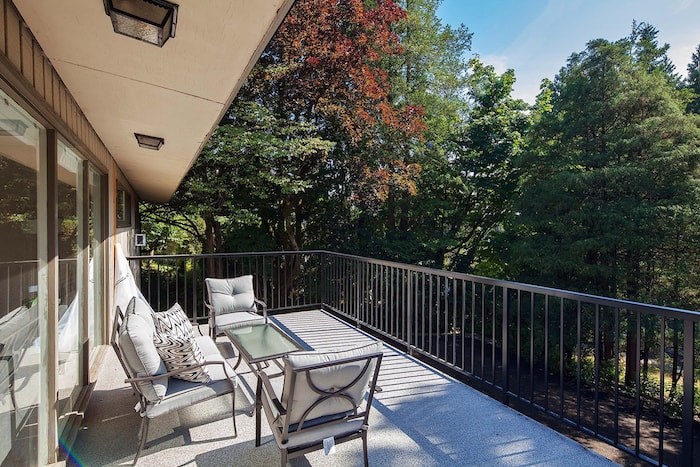  The living room on the top level has access to a generous deck overlooking the large, private yard. Image supplied