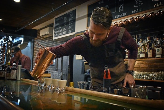  Bartender Mike Hallman prepares a cocktail at Monashee Spirits Craft Distillery. Photo by Rob Mangelsdorf