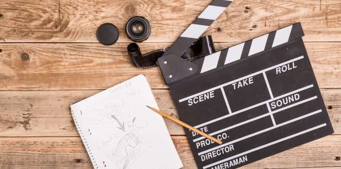  clapperboard, storyboard on wood / Shutterstock