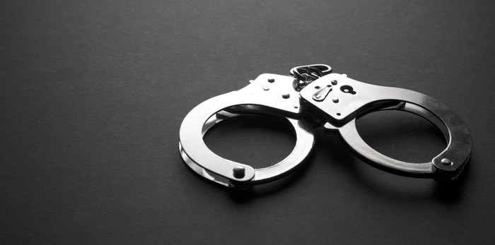  New Westminster police say they’ve nabbed a suspect alleged to have robbed a bank with an airsoft pistol. Photo: Handcuffs/Shutterstock