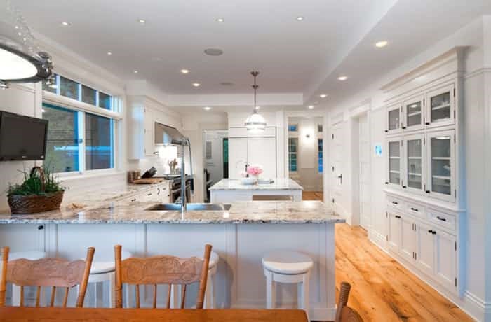  Continuing the beachy white theme is this gourmet kitchen, which flows through to the dining area. Listing agent: Clarence Debelle