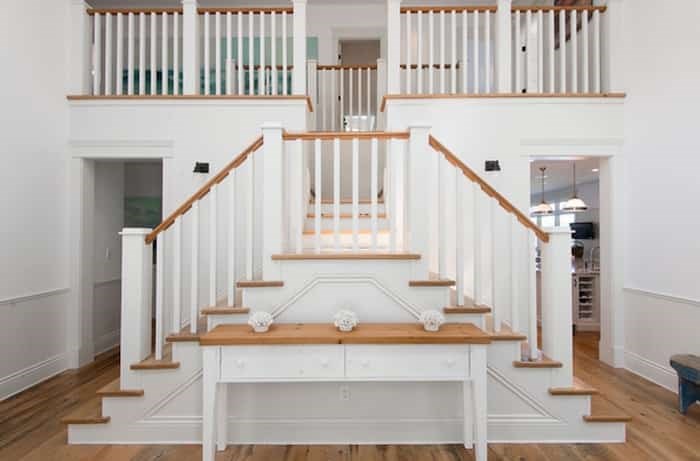  Through the front entrance, the foyer of the main house has this elegant and unusual staircase. Listing agent: Clarence Debelle