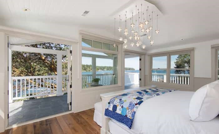  The master bedroom has wonderful views and doors to the second-floor wraparound deck. Listing agent: Clarence Debelle