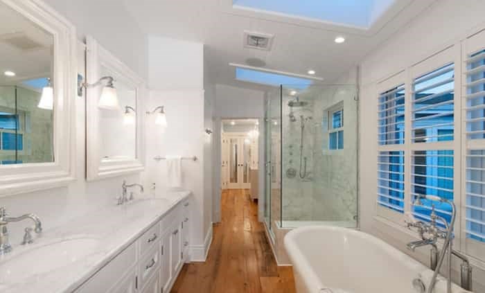  The luxurious master bathroom is flooded with light from not just ample windows but also skylights. Listing agent: Clarence Debelle