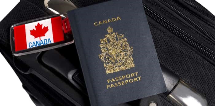  canadian passport on luggage / shutterstock