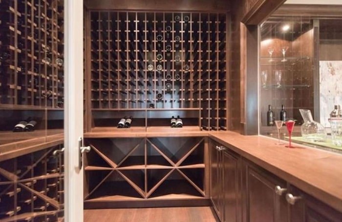  This gorgeous wine room has a window to the lower-level entertainment bar, perfect for holing up in winter. Listing agent: Wendy Tian