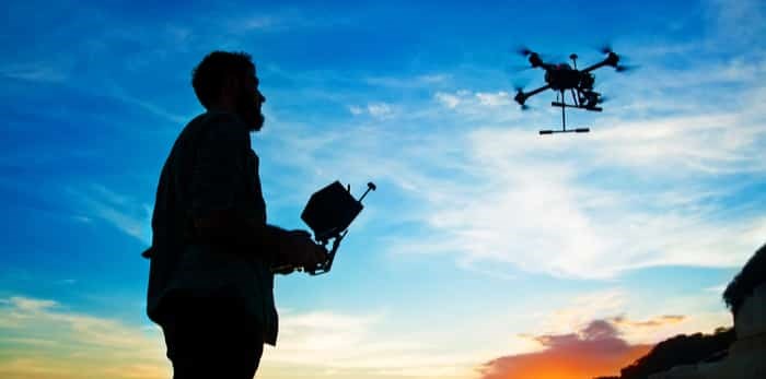  man flying drone / Shutterstock