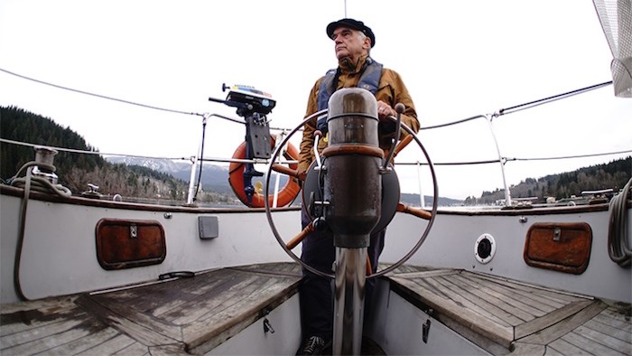  Rob Butler captains a boat on a journey around the Salish Sea to visit artists and professionals for the documentary Returning, which will be shown at the Inlet Theatre in Port Moody Jan. 18. Photo by Mike McKinlay