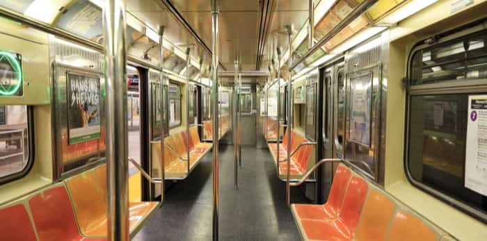  New York, NY, USA - March 15, 2016: Inside of subway wagon: Colorful seats and inside of empty car: The NYC Subway is one of the oldest and most extensive public transportation systems in the world. / Shutterstock