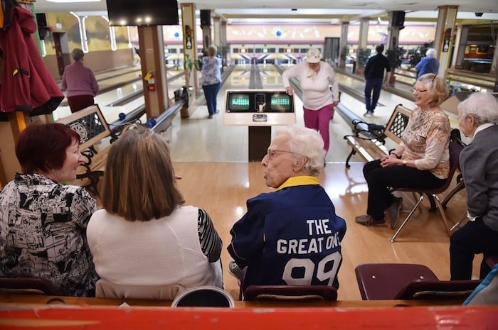  Ethel Morley chats with fellow bowlers between frames. Photo by Dan Toulgoet