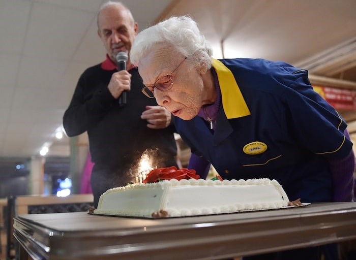  Ethel Morley blows out the candles on her cake as Commodore Lanes league manager Ken Hayden looks on. Photo by Dan Toulgoet