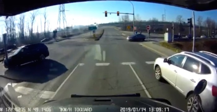  In the distance on the left, the vehicle can be seen having crossed the median. A moment later the car takes off and flips over. Screenshot.