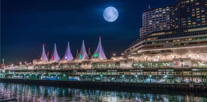  Vancouver BC Canada,October 4 2017. Canada place with full moon backgrounds / Shutterstock