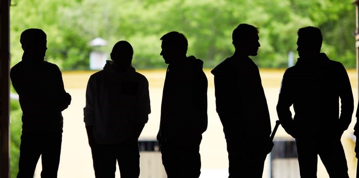  Young men in the shadows/Shutterstock