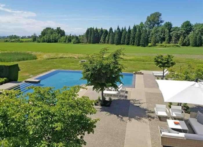  The view from the upper floor reveals that much of this flat, 19-acre property is laid to grassy fields. Listing agent: Manyee Lui