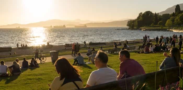  Vancouver, Canada - May 2017. People Enjoy the sunshine at English Bay Beach / Shutterstock