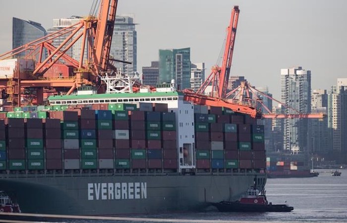  A tugboat is seen near the stern of a freighter after a large crane collapsed on the container ship at Port Metro Vancouver's Vanterm facility, in Vancouver, on Monday January 28, 2019. A spokeswoman for Global Container Terminals Vanterm says the ship was coming in to berth early Monday morning when it made contact with a ship-to-shore crane on the dock, shutting down operations at one dock of the busy port. THE CANADIAN PRESS/Darryl Dyck