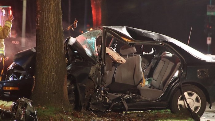  Burnaby firefighters worked to extract a driver from a single-vehicle crash. Photo by Shane Mackichan