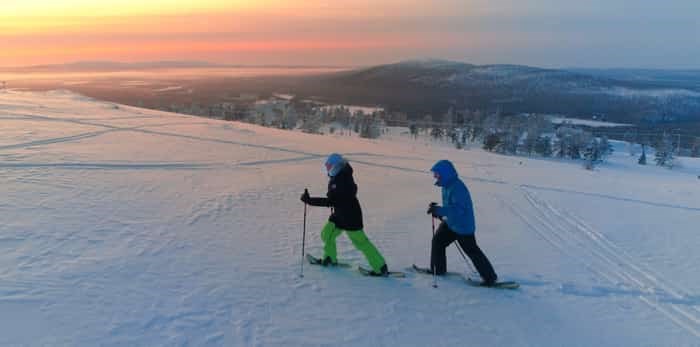  Active couple snowshoeing up a mountain slope / Shutterstock