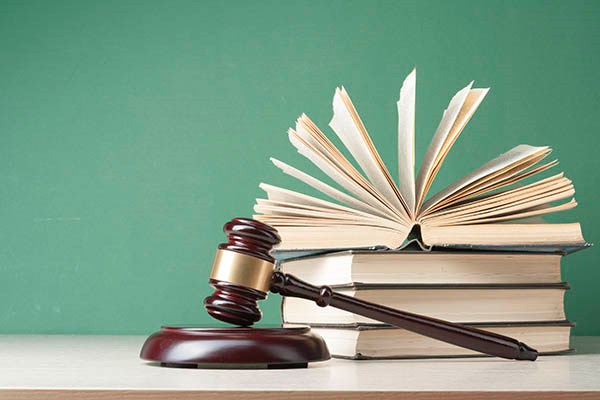  Books with wooden judges gavel /iStock