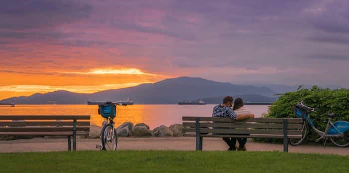  Vancouver Canada,May 2017.romantic couple with sunset backgrounds on the beach / Shutterstock