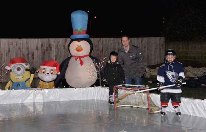  Ladner’s Chris Dinter built a backyard rink for his boys Sam (right), 6, and Jack, 4. Photo courtesy Chris Dinter.