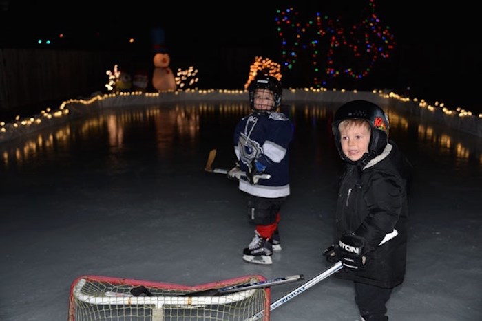  Sam and Jack Dinter went for a skate last night on their backyard rink. Photo courtesy Chris Dinter