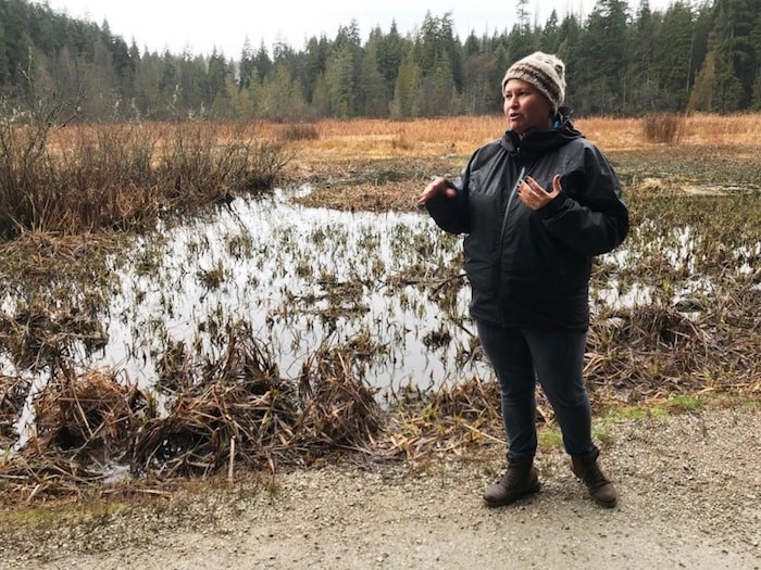  Talaysay Tours co-owner Candice Campo stands near Beaver Lake in Stanley Park during the Talking Trees tour. Photo Sandra Thomas