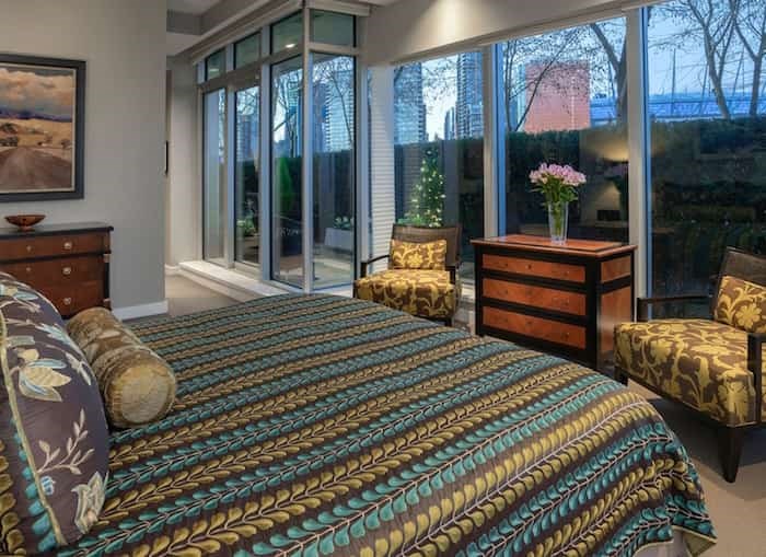  The light-filled master bedroom has a walk-through closet and a large, luxurious ensuite bathroom. Listing agents: Mike Rampf and Shawn Anderson