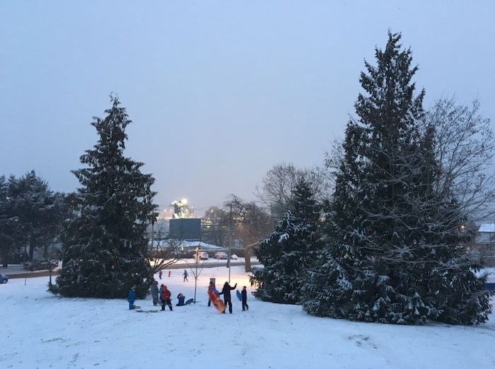  There is a special kind of light that a blanket of snow gives off at night, reflecting the street lights and the moon, allowing kids to stay out just a little bit later than usual on these special snowy occasions. Photo Grant Lawrence