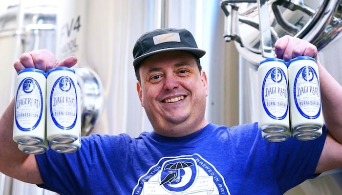  Ben Coli, owner of Dageraad Brewing, with his Burnabarian beer. Photo by Cornelia Naylor