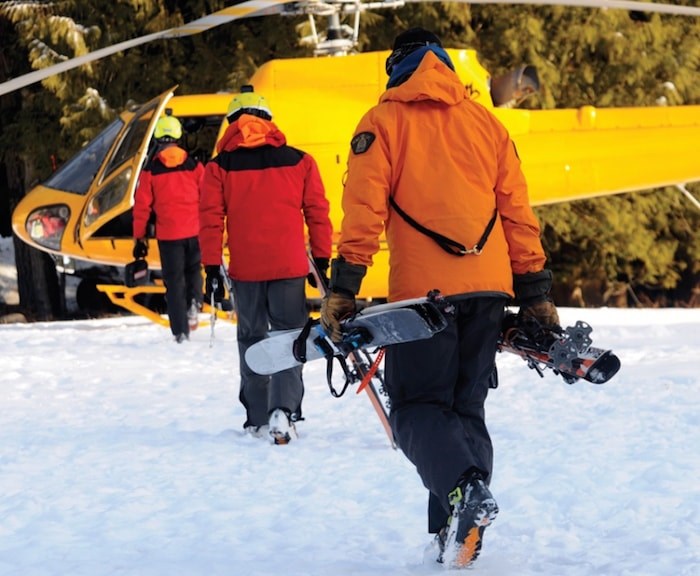  North Shore Rescue volunteers board a helicopter before resuming the search for Surrey hiker Remigiusz Michalowski. Photo by Mike Wakefield/North Shore News