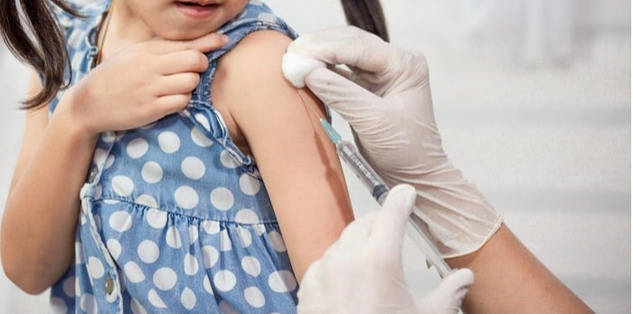  Child receiving immunization/Shutterstock