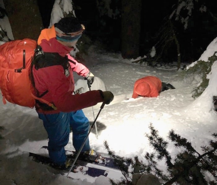  A North Shore Rescue volunteer prepares to help a lost snowboarder near the Howe Sound Crest Trail. photo supplied, North Shore Rescue