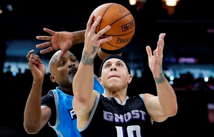  FILE - This is a July 16, 2017, file photo showing Ghost Ballers' Mike Bibby (10) attempting a shot as Power's Cuttino Mobley defends during the first half of a BIG3 Basketball League game in Philadelphia. Officials in a suburban Phoenix school district say police are investigating sexual abuse and harassment accusations lodged against former NBA player Mike Bibby, who coaches a school basketball team. (AP Photo/Rich Schultz, File)