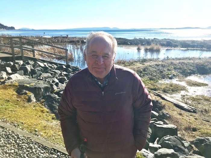 Tsatsu Shores resident Jim Northey in front of the pond where dozens of waterfowl were discovered dead.