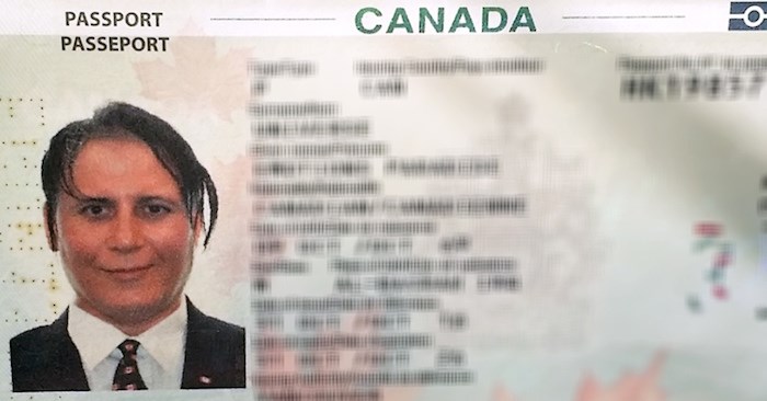  Emotions Paradise Universe, a refugee from Iraq, proudly wears a Maple Leaf tie and pin for his Canadian passport photo. For a year after homicide investigators came to his door and asked him out of the blue for a voluntary DNA sample in 2017, he believed the RCMP was trying to frame him for the murder of Marrisa Shen. (Photo courtesy Emotions Paradise Universe)