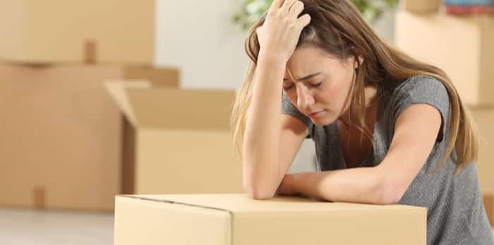  woman sad while moving / Shutterstock