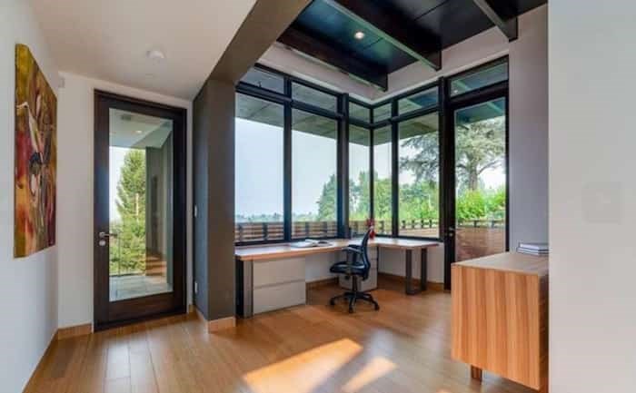  The high ceilings, panoramic views and terrace door make this home office a great place to work. Listing agent: Faith Wilson